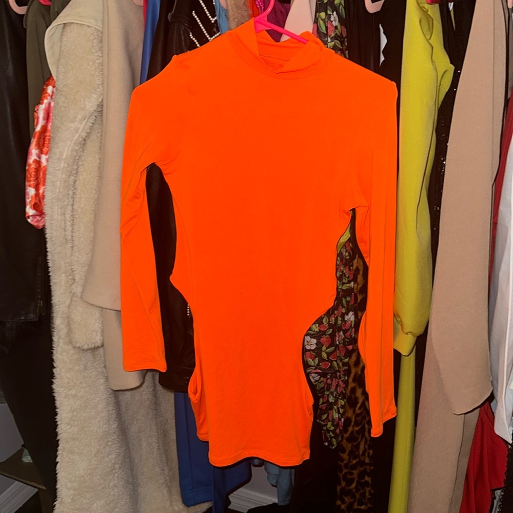 Oh Polly has done it again in this sexy number in hot orange mini dress. Size 2